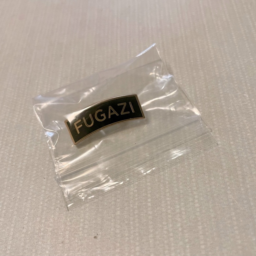 Supreme Fugazi Black and Gold Pin